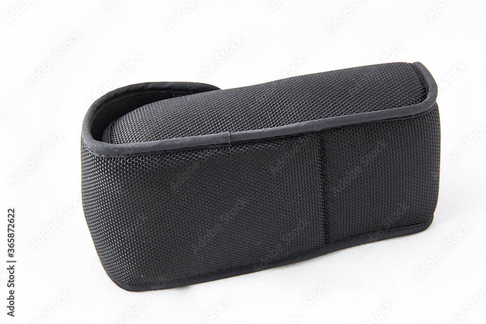 Naklejka premium The back of a black external camera flash light cover, on a white background.