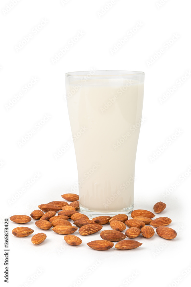 Close Up glass of Almond milk with Almond seeds. on white background Close Up glass of Almond milk with Almond seeds. on white background