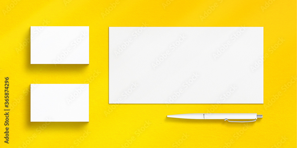 Minimalist Stationery Mockup Set of Business Cards, Envelope and Pen on yellow background Minimalist Stationery Mockup Set of Business Cards, Envelope and Pen on yellow background