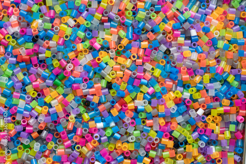 multi-colored plastic beads, small pieces of plastic mosaic, background for children's creativity
