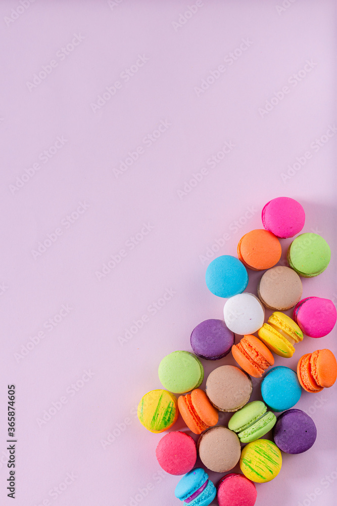 Creative composition with envelope and cake macaron or macaroon on pink pastel background top view. Flat lay. Creative composition with envelope and cake macaron or macaroon on pink pastel background top view. Flat lay.