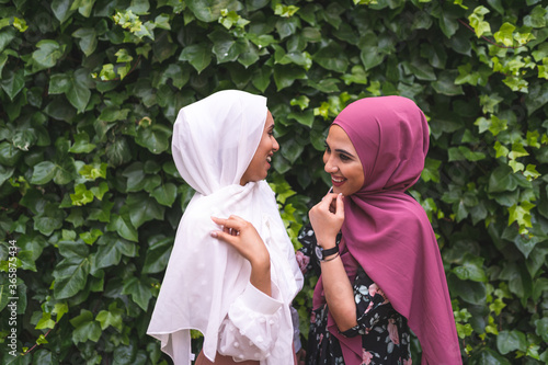 Bild auf Leinwand Beautiful Arab Girls Having Fun in Nature . Friendship Concept.