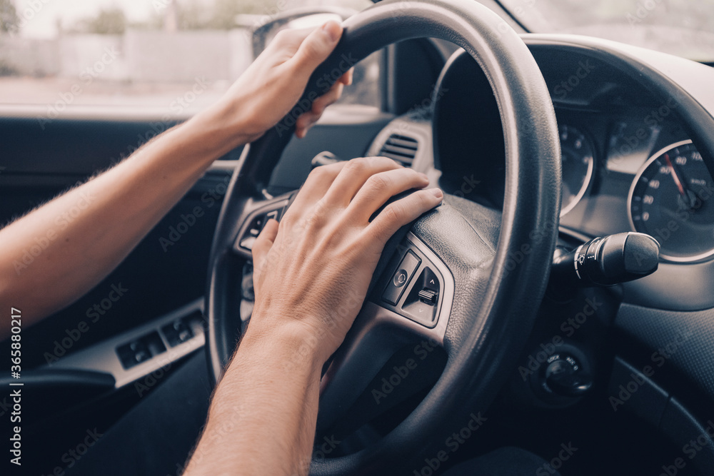 Naklejka premium angry driver presses the horn of the car to attract the attention of the car bully and avoid road accident. Stress and aggressive driving on city streets