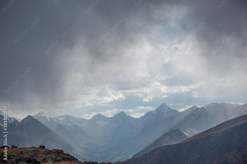 snowy mountains with storm clouds near Beluha
