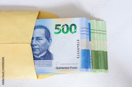 Five hundred mexican pesos money envelop folder stack top view