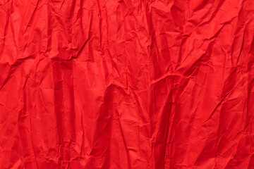 Red crumpled paper texture, grunge background