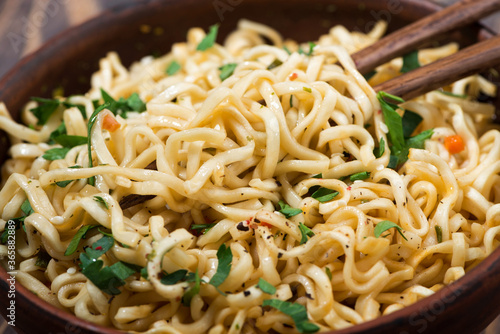 bowl of traditional Chinese noodles, top view closeup