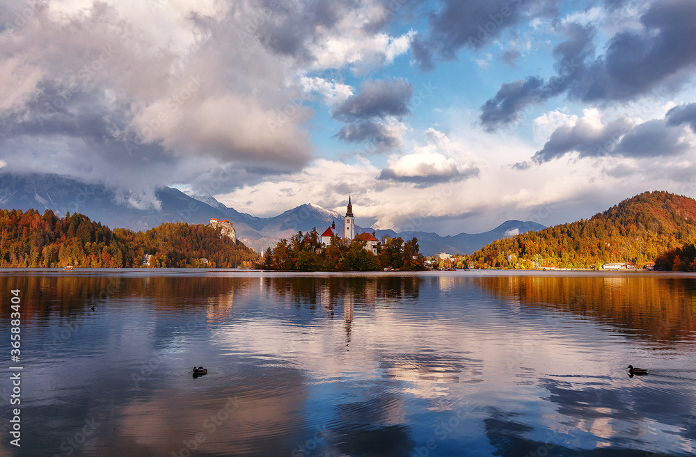 Wonderful Nature landscape. Great view of Famouse Bled Lake in summer day. Amazing Sunny Scenery with fairy tale lake during sunset. Julian Alps. Slovenia. Popular Travel destinations