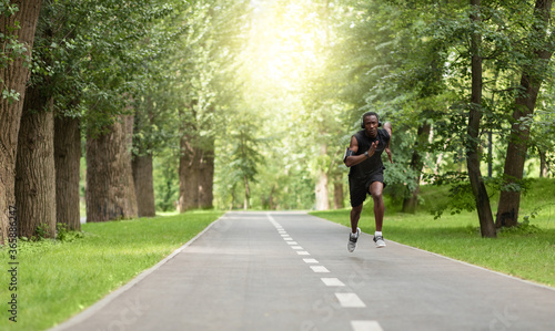 Wallpaper Mural Black man jogger training at park, getting ready for marathon Torontodigital.ca