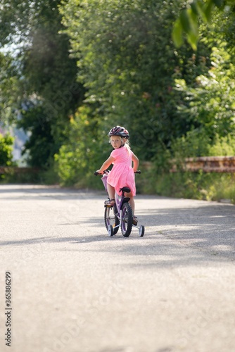 Wallpaper Mural The first bike ride a little girl learns to ride a bicycle. Torontodigital.ca