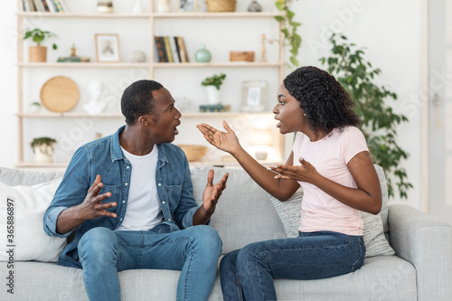 Young african man and woman arguing at home