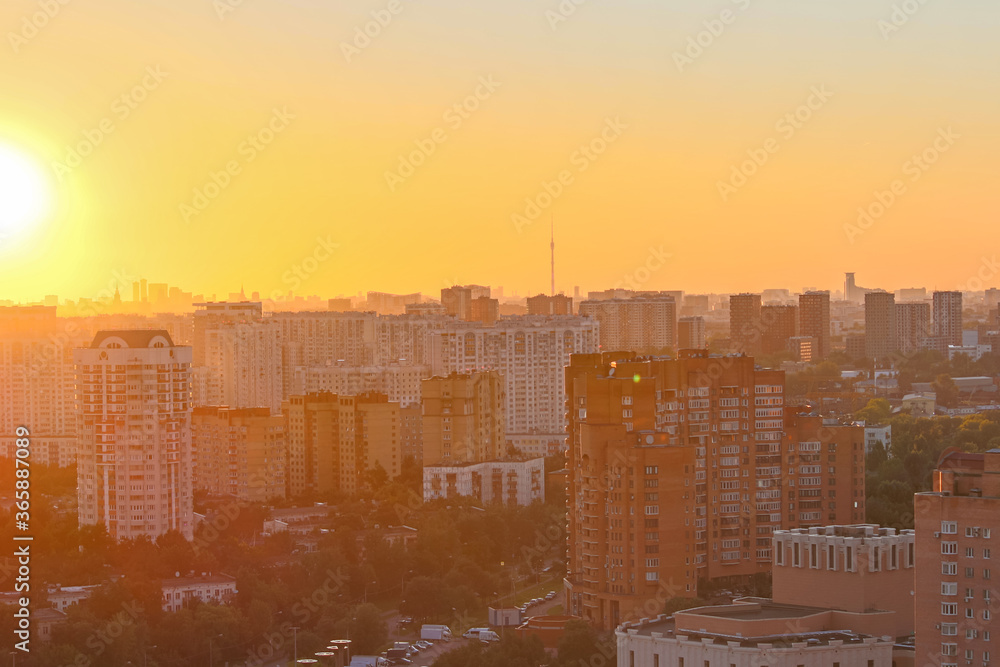 Cityscape of Moscow city in Russia during golden sunset. Small haze in the air. Golden hour theme.