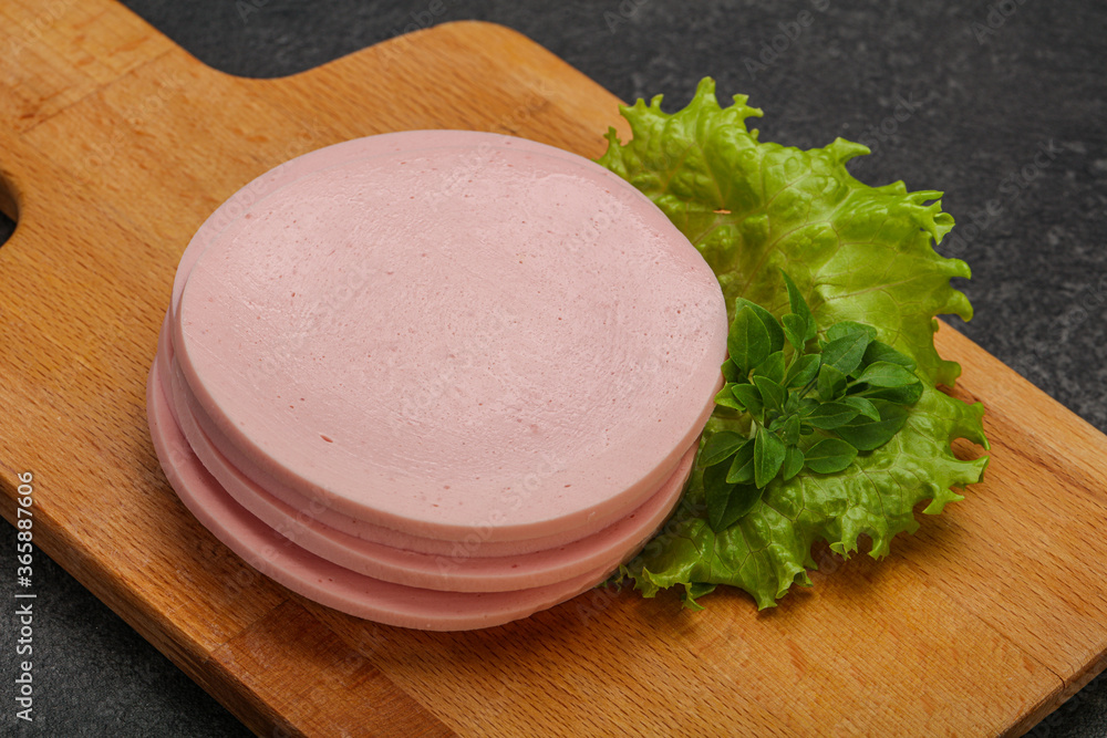 Sliced pork natural sausages over board Sliced pork natural sausages over board