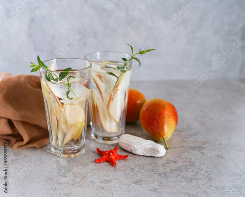 Cool summer drinks, pear cocktails with ice in glasses. photo