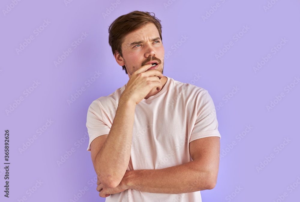 cunning bearded man conceived something, thougthful guy in casual wear looks away, in contemplation cunning bearded man conceived something, thougthful guy in casual wear looks away, in contemplation