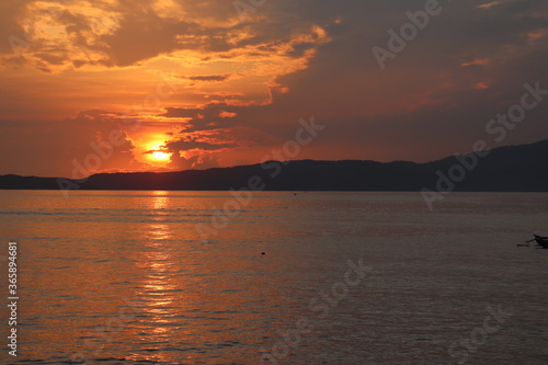 The Sun Rises Illuminating the Tanah Merah Bay Jayapura – Papua photo