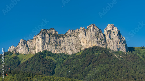 Annecy in France, the cliffs on the lake in summer, with paragliding 