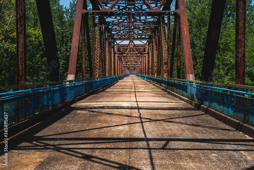 Saint Louis, MO--July 18, 2020; view of the deck of Chain of Rocks Bridge, former Route 66 crossing of the Mississippi River at Saint Louis that now serves as a pedestrian and bicycle bridge.