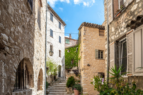 A small crowded courtyard of homes in the picturesque touristic center of the medieval village of Tourrettes Sur Loup in the South of France. © Kirk Fisher