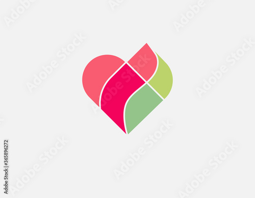Minimalistic multicolored geometric logo heart from puzzles.