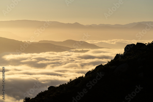Early morning view of misty mountains ridges and canyons north of Chatsworth in Los Angeles, California. 