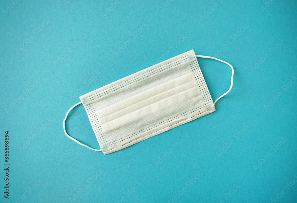 Prevent Coronavirus, protection factor for wuhan virus.Medical mask, Medical protective mask on blue background. Disposable surgical face mask cover the mouth and nose. Healthcare and medical concept. Prevent Coronavirus, protection factor for wuhan virus.Medical mask, Medical protective mask on blue background. Disposable surgical face mask cover the mouth and nose. Healthcare and medical concept.