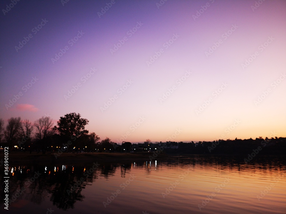 Obraz premium sunset over the river