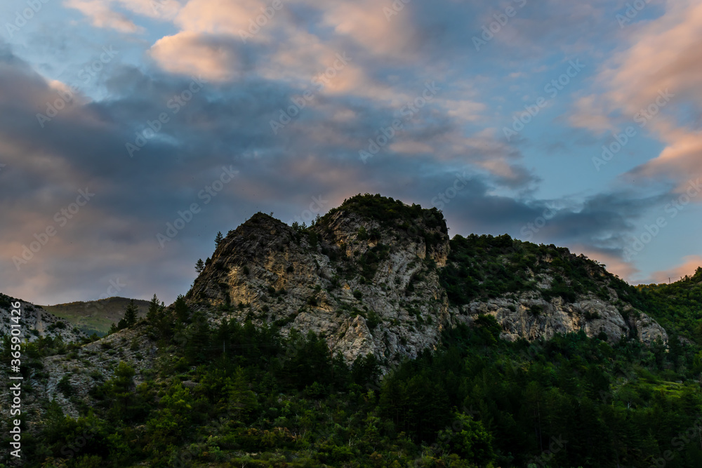 A picturesque landscape view of the Alps mountain cliff top after sunset (Puget-Theniers, Alpes-Maritimes, France)