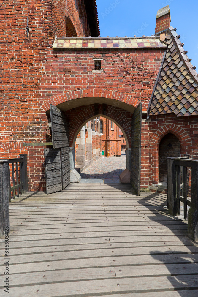 Naklejka premium 13th century Malbork Castle, medieval Teutonic fortress on the Nogat River, Malbork, Poland