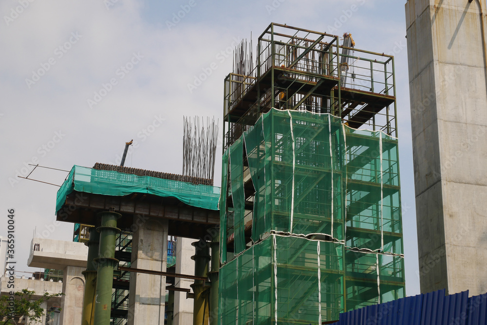 SEREMBAN, MALAYSIA -MAY 24, 2020: Temporary access and metal staircase made from staging, scaffolding and metal platform under construction at the construction site. 