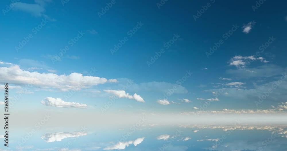 futuristic background consisting of Time lapse clip of white fluffy clouds over blue sky and their reflection, video loop futuristic background consisting of Time lapse clip of white fluffy clouds over blue sky and their reflection, video loop