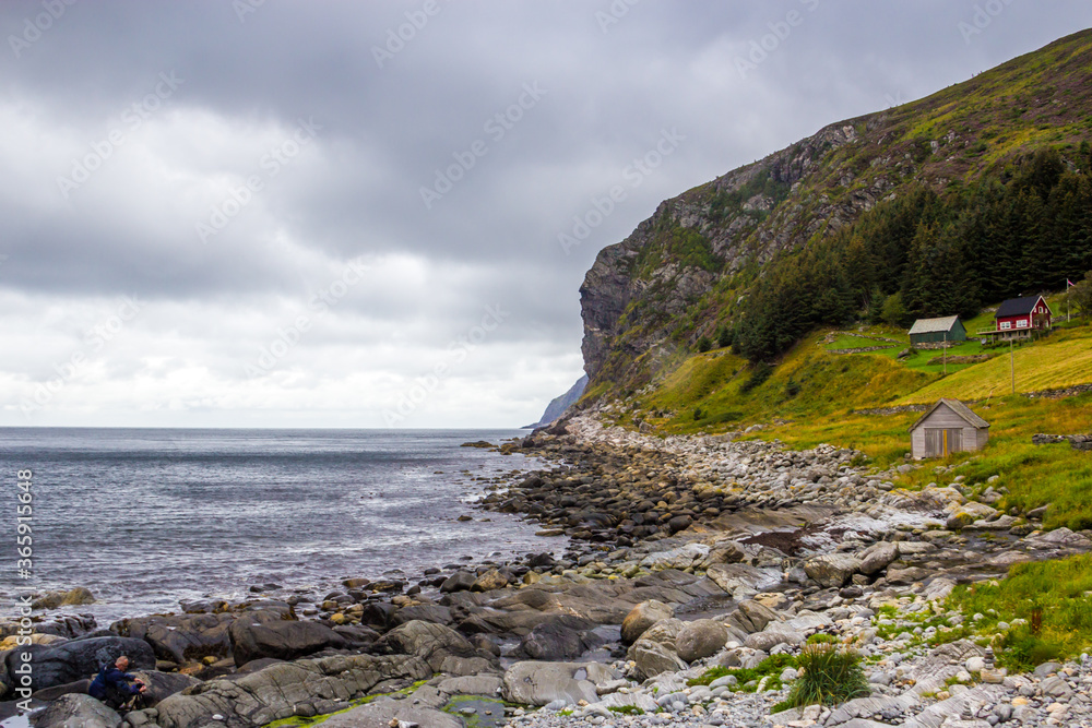 rainy clouds over the Kannesteinen rock on the coast of Norway