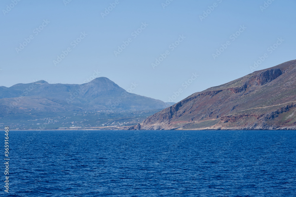 Rocky coast line of Crete, Greece. View from the ship. Copy space.