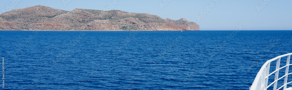 Rocky coast line of Crete, Greece. View from the ship. Copy space.