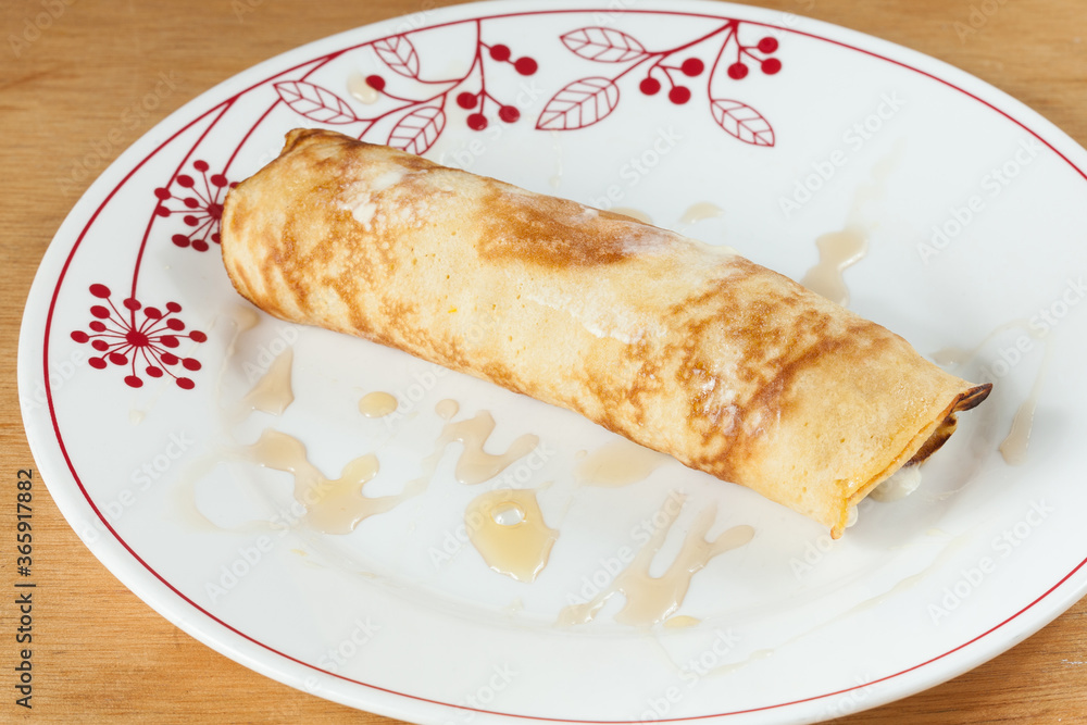 Tasty And Healthy Breakfast; Pancakes On A Roll with honey. Tasty And Healthy Breakfast; Pancakes On A Roll with honey.