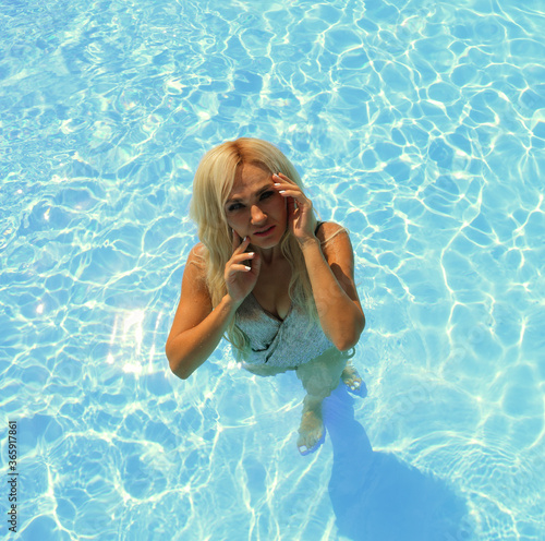 Top view of young woman in swimming pool