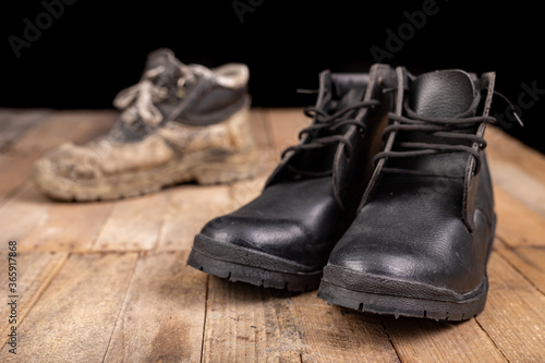 Old work shoe. New work shoes for production workers.