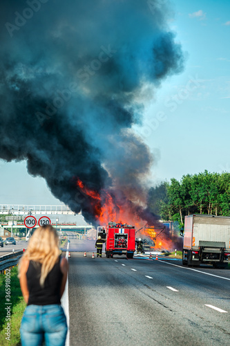 accident and fire on the road vertically photo