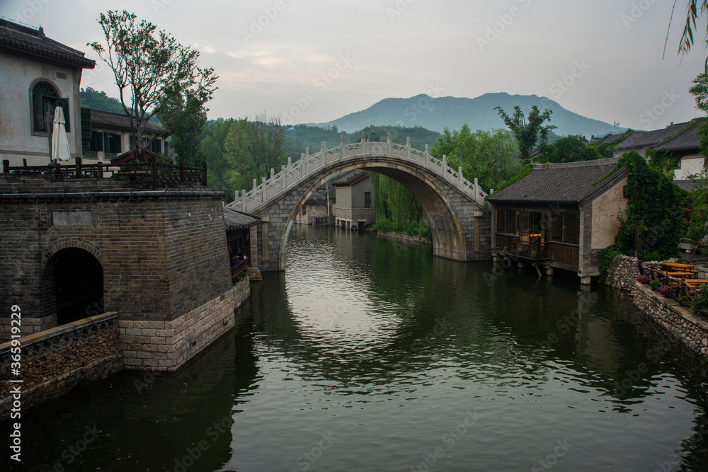 Historical small bridge over the river in a village