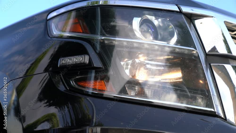 Close up of a police car cruiser interceptor, with the emergency lights on at a crime scene with fog in the background. An emergency response police car with selective focus. Close up of a police car cruiser interceptor, with the emergency lights on at a crime scene with fog in the background. An emergency response police car with selective focus.