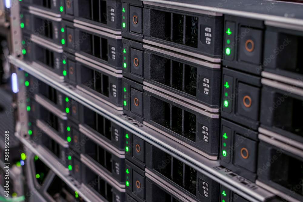 Hosting of web services is available in the server room of the data center. Many hard drives are installed in the storage server slots. Hosting of web services is available in the server room of the data center. Many hard drives are installed in the storage server slots.
