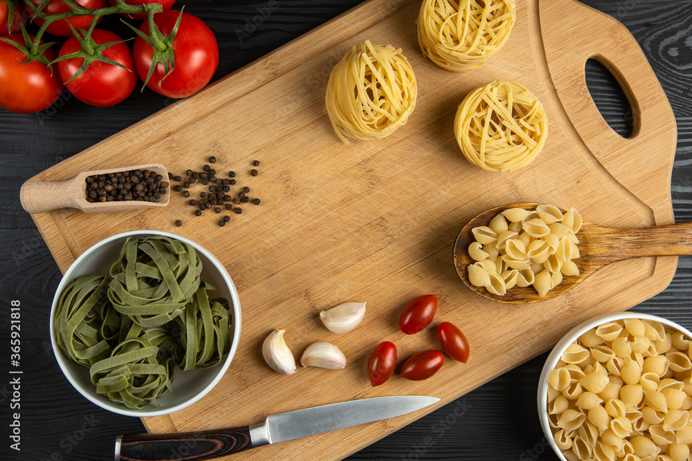 A bunch of tomatoes with italian pasta around A bunch of tomatoes with italian pasta around