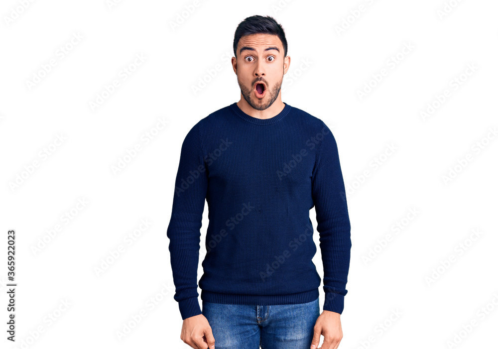 Young handsome man wearing casual clothes afraid and shocked with surprise expression, fear and excited face. Young handsome man wearing casual clothes afraid and shocked with surprise expression, fear and excited face.