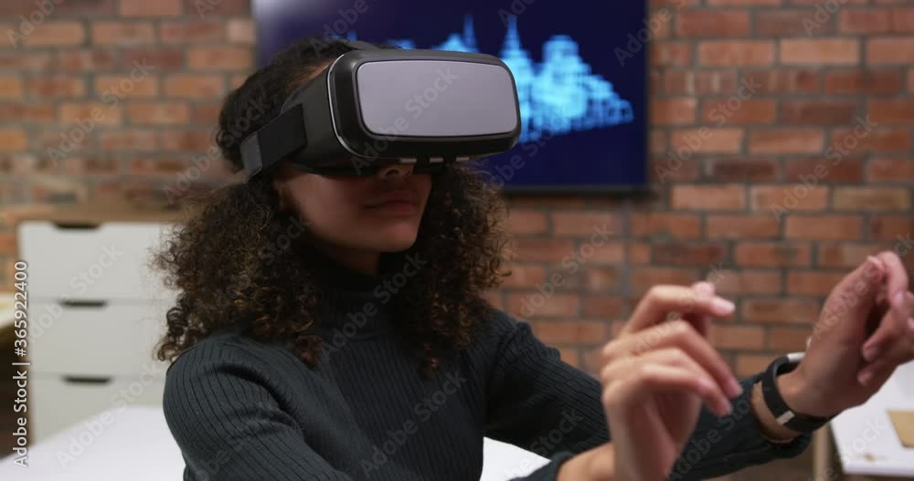 Creative businesswoman using virtual reality headset in modern office Creative businesswoman using virtual reality headset in modern office