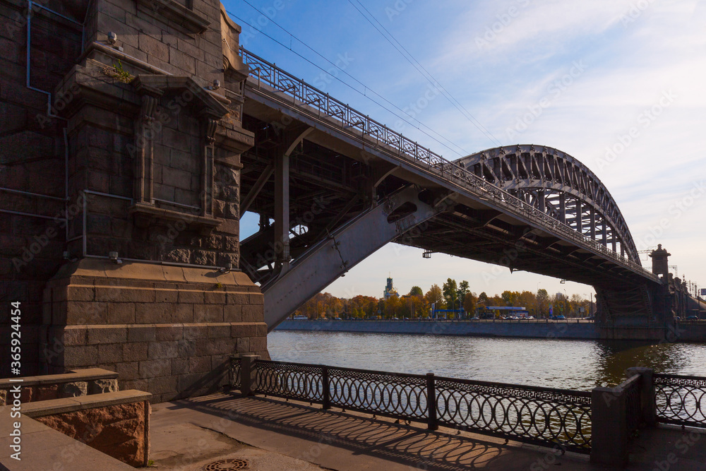Metal arch bridge over the river