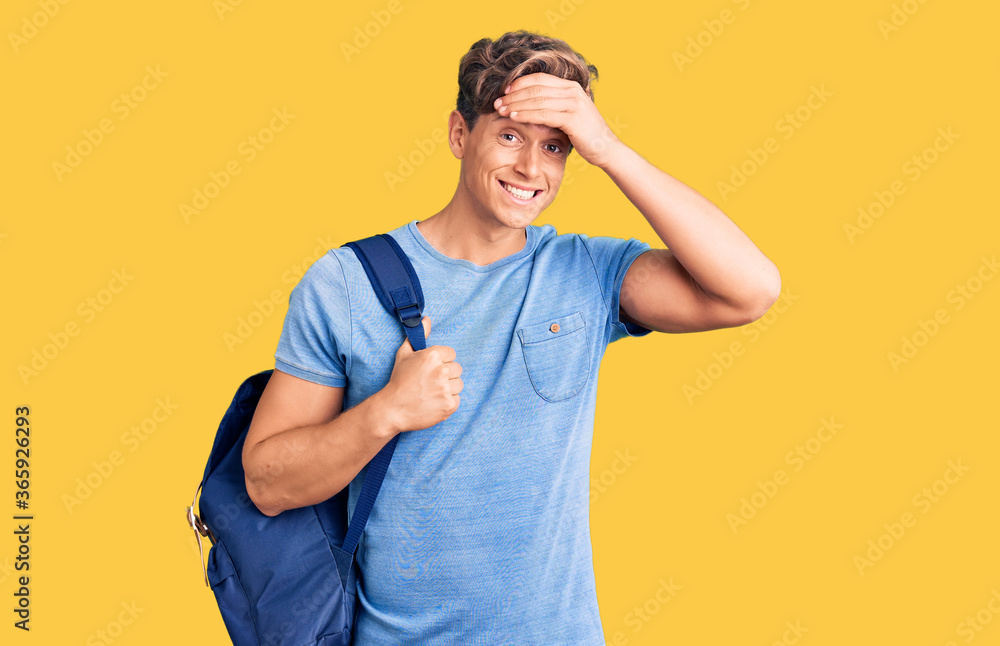 Young handsome man holding student backpack stressed and frustrated with hand on head, surprised and angry face Young handsome man holding student backpack stressed and frustrated with hand on head, surprised and angry face
