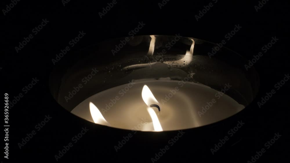 Close Up Of Three Flame Candle In The Dark. Locked Off Close Up Of Three Flame Candle In The Dark. Locked Off