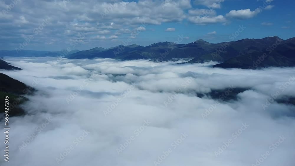 Dense clouds hang in a valley in Austria. Dense clouds hang in a valley in Austria.