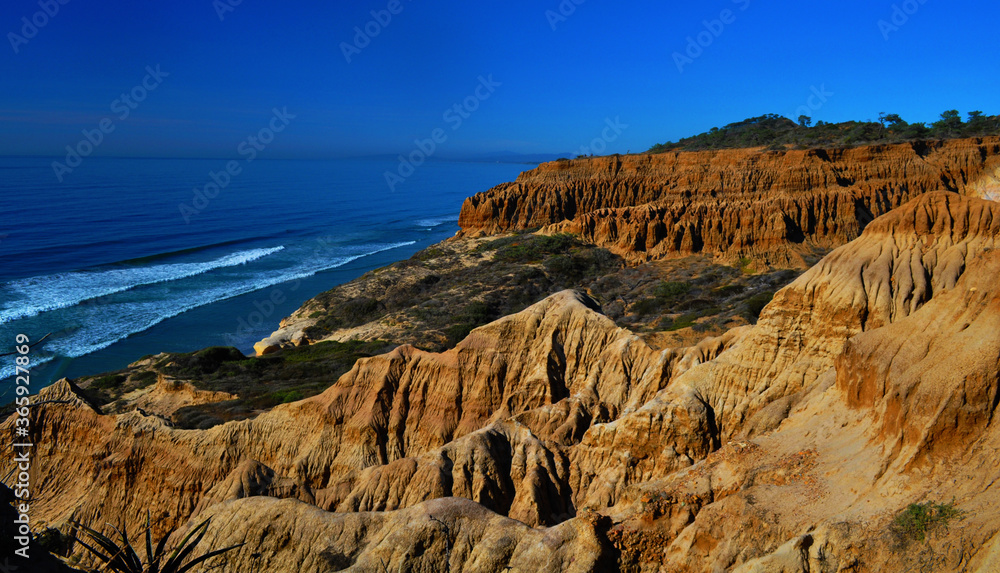 Cliffs by a blue sea