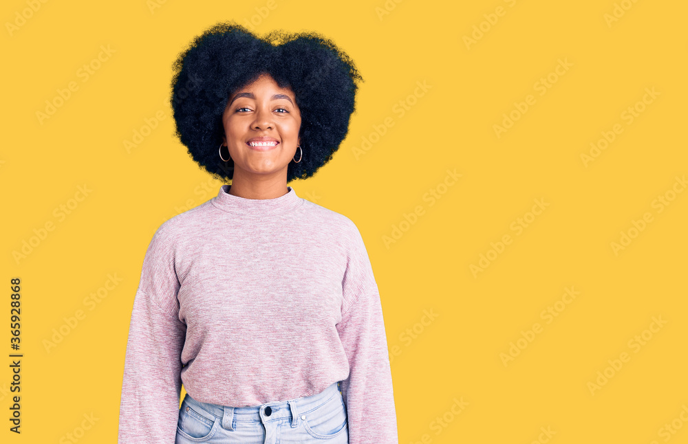 Young african american girl wearing casual clothes with a happy and cool smile on face. lucky person. Young african american girl wearing casual clothes with a happy and cool smile on face. lucky person.